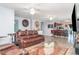Open-concept living room with tile flooring, comfortable seating, ceiling fans and access to the kitchen at 1827 Peaceful Palm St, Ruskin, FL 33570