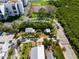 The aerial view shows the property with defined boundaries, tropical foliage, and nearby amenities at 19109 2Nd St, Indian Shores, FL 33785