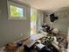 Bedroom with sliding door leading to the backyard needing significant repair or renovations at 19109 2Nd St, Indian Shores, FL 33785