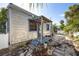Shows weathered exterior of a cottage-style home, revealing its vintage charm and character at 19109 2Nd St, Indian Shores, FL 33785