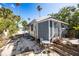 Cozy home featuring a stone patio, perfect for outdoor seating at 19109 2Nd St, Indian Shores, FL 33785