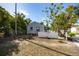 Quaint single-story home with a fenced yard and mature trees at 19109 2Nd St, Indian Shores, FL 33785