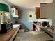 Dated kitchen needing renovations, featuring worn countertops and appliances, plus window view at 19109 2Nd St, Indian Shores, FL 33785