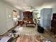 Living room in need of refurbishment with hardwood floors and traditional furniture at 19109 2Nd St, Indian Shores, FL 33785