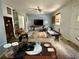 Living room with ceiling fan, light blue walls, and light-filled windows at 19109 2Nd St, Indian Shores, FL 33785