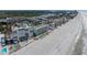 Aerial view of the beach showcasing the condo complex, pool, and ocean views at 19440 Gulf Blvd # 301, Indian Rocks Beach, FL 33785