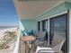 Inviting balcony with seating, offering a tranquil spot to enjoy views of the beach and ocean at 19440 Gulf Blvd # 301, Indian Rocks Beach, FL 33785