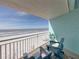 Inviting balcony seating with beautiful ocean views, perfect for relaxing at 19440 Gulf Blvd # 301, Indian Rocks Beach, FL 33785