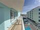 Relaxing balcony overlooking the pool, offering a serene outdoor space to unwind and enjoy the view at 19440 Gulf Blvd # 301, Indian Rocks Beach, FL 33785