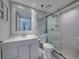 Bathroom featuring a glass-enclosed shower and updated fixtures at 19440 Gulf Blvd # 301, Indian Rocks Beach, FL 33785