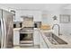 Modern kitchen with granite counters, stainless steel appliances, and decorative coastal accents at 19440 Gulf Blvd # 301, Indian Rocks Beach, FL 33785