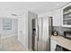 Modern kitchen features stainless steel refrigerator and granite countertops at 19440 Gulf Blvd # 301, Indian Rocks Beach, FL 33785