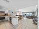 Open concept kitchen with granite countertops and stainless steel appliances at 19440 Gulf Blvd # 301, Indian Rocks Beach, FL 33785