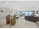 Light-filled living and dining area with ocean views and coastal decor at 19440 Gulf Blvd # 301, Indian Rocks Beach, FL 33785
