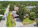 Aerial view of a quaint single-Gathering home with lush landscaping in a charming residential neighborhood at 2 S Treasure Dr, Tampa, FL 33609