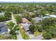 Aerial view of a charming single-Gathering home surrounded by lush green trees in a quiet neighborhood at 2 S Treasure Dr, Tampa, FL 33609
