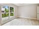 Spacious bedroom with wood floors and large windows offering lots of natural light at 2 S Treasure Dr, Tampa, FL 33609