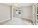 Bedroom features a large window, wood flooring, closet with mirrored doors and overhead lighting at 2 S Treasure Dr, Tampa, FL 33609