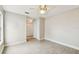 Well-lit bedroom with tiled floors, a ceiling fan, and neutral-colored walls at 2 S Treasure Dr, Tampa, FL 33609