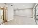 Large bonus room featuring neutral walls, wood-look tile flooring and access to a patio through sliding glass doors at 2 S Treasure Dr, Tampa, FL 33609