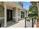 Welcoming front porch with elegant columns and a decorative front door at 2 S Treasure Dr, Tampa, FL 33609