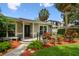 Inviting front porch with stylish railings and vibrant landscaping at 2 S Treasure Dr, Tampa, FL 33609