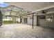 Covered and enclosed lanai with ceiling fan and adjacent to multiple indoor living spaces at 2 S Treasure Dr, Tampa, FL 33609