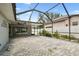 Spacious covered and enclosed lanai with pavers and outdoor lighting perfect for entertaining at 2 S Treasure Dr, Tampa, FL 33609