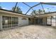 Spacious covered and enclosed lanai with pavers and access to the home's living spaces at 2 S Treasure Dr, Tampa, FL 33609