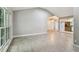 Open-concept living room with light gray wood-look tile floors and recessed lighting at 2 S Treasure Dr, Tampa, FL 33609