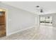 Spacious living room features tile floors, a ceiling fan, recessed lighting, and natural light at 2 S Treasure Dr, Tampa, FL 33609