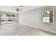 Open living room features tile floors, a ceiling fan, recessed lighting, and natural light at 2 S Treasure Dr, Tampa, FL 33609