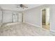 Large main bedroom with en-suite bathroom, mirrored closet doors, and wood flooring at 2 S Treasure Dr, Tampa, FL 33609