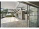 Covered patio featuring stone floors, a ceiling fan, and a view of the backyard at 2 S Treasure Dr, Tampa, FL 33609
