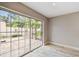 A room featuring a sliding glass door that allows natural light, and tile floors at 2 S Treasure Dr, Tampa, FL 33609