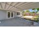 Covered patio with door leading to fenced backyard that is ready for relaxing or playing at 2509 W Crawford St, Tampa, FL 33614