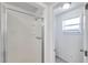 Bathroom view showcases a glass door shower and window for natural light at 2509 W Crawford St, Tampa, FL 33614