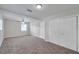 Bright carpeted bedroom featuring ample closet space and a ceiling fan at 2509 W Crawford St, Tampa, FL 33614