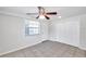Bedroom featuring tile floors, a ceiling fan, and a bright window at 2509 W Crawford St, Tampa, FL 33614