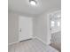 Entryway boasting neutral paint and tiled floor, leading to carpeted living spaces at 2509 W Crawford St, Tampa, FL 33614