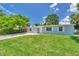 Charming single-story home with a well-maintained lawn and a classic front facade under a bright, sunny sky at 2509 W Crawford St, Tampa, FL 33614