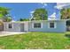Inviting single-story home with manicured lawn, showcasing a clean and appealing exterior design at 2509 W Crawford St, Tampa, FL 33614