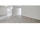 Neutral-toned living space with tiled flooring, offering a clean and open layout at 2509 W Crawford St, Tampa, FL 33614