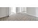 Open-concept living space with neutral tile flooring and freshly painted neutral walls at 2509 W Crawford St, Tampa, FL 33614