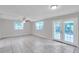 Living room featuring tile floors, natural light, and a ceiling fan at 2509 W Crawford St, Tampa, FL 33614