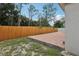 A spacious backyard features a brick-paved patio and wood fence creating a perfect outdoor living space at 2625 Brookville Dr, Valrico, FL 33596
