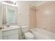 Bathroom featuring a vanity, toilet, and tiled shower/tub combo at 2625 Brookville Dr, Valrico, FL 33596