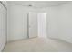 Bedroom featuring neutral carpet and a connecting doorway at 2625 Brookville Dr, Valrico, FL 33596