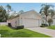 Attached two car garage showcasing its ample size and well-kept surroundings at 2625 Brookville Dr, Valrico, FL 33596