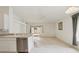 Bright, open-concept kitchen and living area with sliding glass doors to a patio and abundant natural light at 2625 Brookville Dr, Valrico, FL 33596